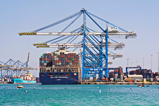 Port activities, big container ship discharging and loading in freeport in Birzebbuga, Malta