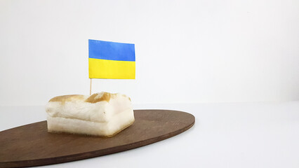 the flag of Ukraine is inserted into the Ukrainian dish lard
