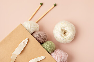 Craft hobby background with yarn in natural colors. Recomforting hobby to reduce stress for cold...