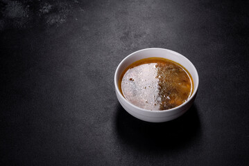 Mushroom soup plate with porcini mushrooms, fresh parsley and pepper