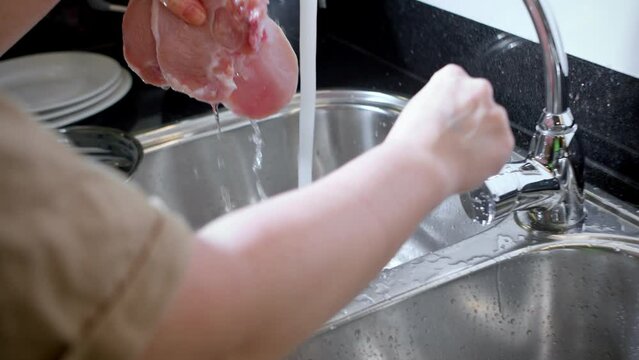 Women's Hands Washing Pork Meat Under Tap Water, Washing Food Before Cooking