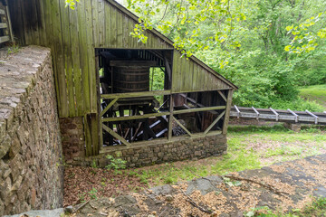 Water wheel at Hopewell Furnace National Historic Site in Pennsylvania. American "iron plantation," with charcoal-fired cold-blast iron blast furnace. Waterwheel supplied the power for air blast.