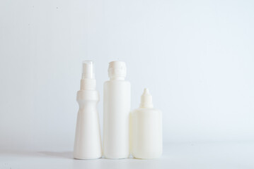 Fototapeta na wymiar disposable bottles on table with white background