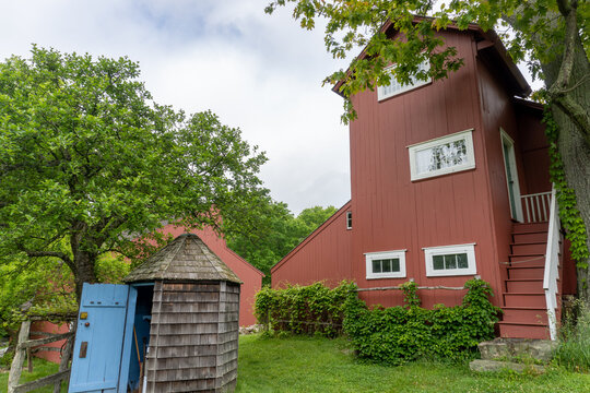 Weir Farm National Historical Park In Connecticut. Weir Studio Was Workspace Of Julian Alden Weir. South Exterior, Red Two Story High Building With Multi-pane Windows On All Sides. 