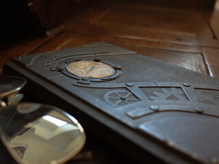A Journal sitting on a dark wooden desk