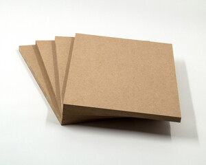 Four panels of light brown raw mdf, arranged in the shape of a fan.