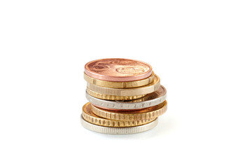 Small EU euro coins stack isolated on white background. Metal coin money. Financial growth. Market crisis and fragile market. Close up view