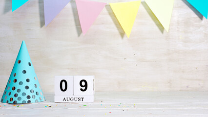 Birthday August 9 on the calendar. Happy birthday card with date copy space. Holiday decorations for congratulations, place for text.