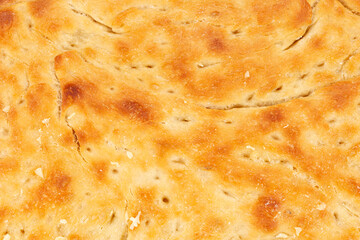 Fresh homemade focaccia bread close up with a shallow depth of field