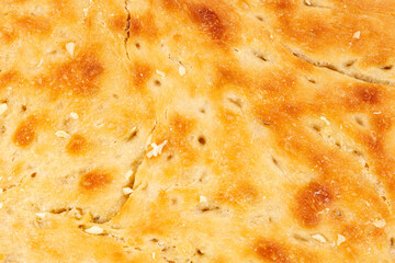 Fresh homemade focaccia bread close up with a shallow depth of field