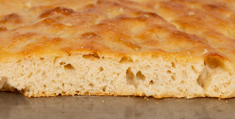 Fresh homemade focaccia bread close up with a shallow depth of field
