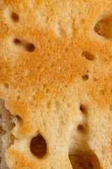 Fresh homemade focaccia bread close up with a shallow depth of field