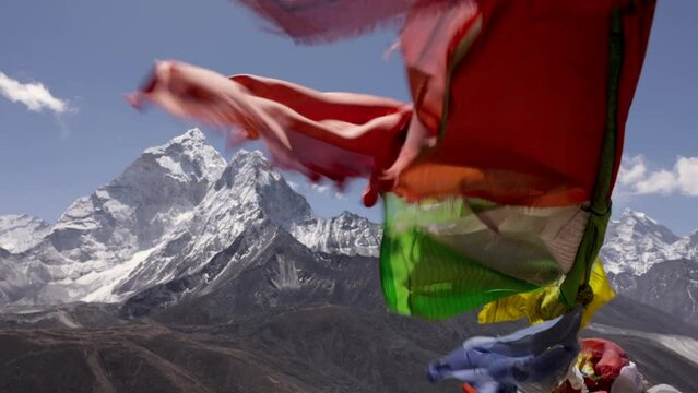 prayer flags in high wind in nepal mountains mount everest base camp trek