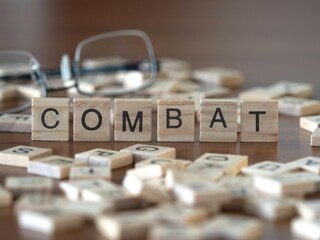 combat word or concept represented by wooden letter tiles on a wooden table with glasses and a book