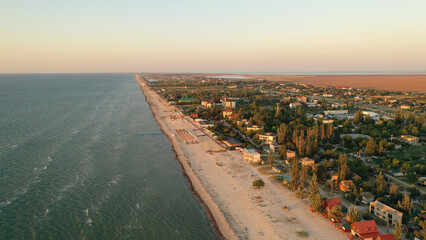 Panorama of sea shore in South Ukraine, Europe. Resort city with nice sand beach and clear blue sea. travel destination, ideal place for comfort vacation on black Sea. Drone photo