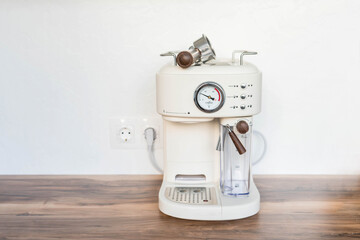 coffee equipment: detail of a white automatic coffee machine