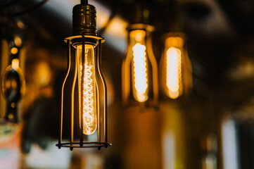 A beautiful electric glass lamp in a metal frame hangs from the ceiling in the interior.