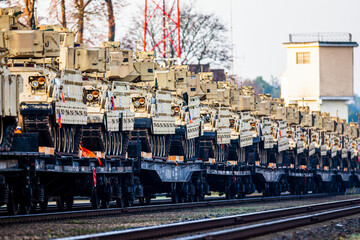 Obraz premium Pabrade/Lithuania October 21, 2019 US Army's 1st Armoured Battalion of the 9th Regiment, 1st Division from Fort Hood in Texas Bradley is unloaded as they arrive at the Pabrade railway station.
