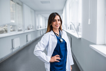 Portrait of a young doctor standing in the corridor of the clinic