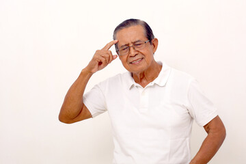 Fototapeta premium Thoughtful asian old man standing while touching head and closing eyes.Isolated on white background.