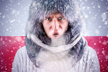 Isolate. Cold weather. Bask. A man in a fur hat and scarf warms his hands with his mouth. It's...