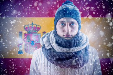 Isolate. Cold weather. Bask. A man in a fur hat and scarf warms his hands with his mouth. It's...