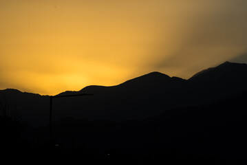 landscape in the shadows of a sunset, clear sky
