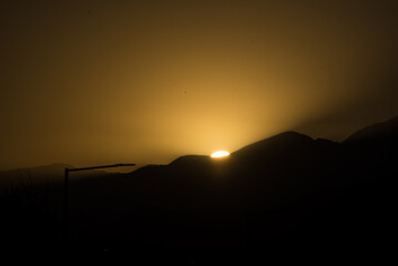 landscape in the shadows of a sunset, clear sky