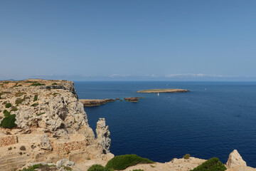 Fototapeta na wymiar Illot des Pas, small island near Cape de Cavalleria - the northernmost point of the Minorca island. Minorca (Menorca), Spai