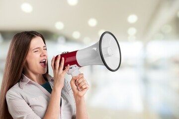Exultant happy young woman hold scream in megaphone announces discounts sale