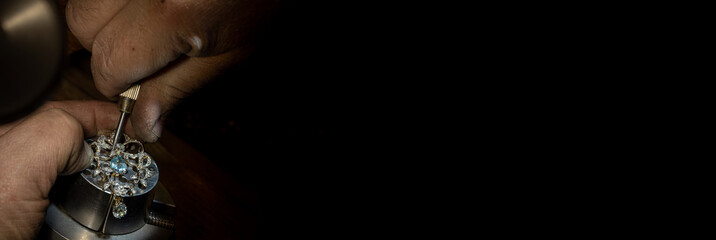 Different goldsmiths tools on the jewelry workplace. Jeweler at work in jewelry. Desktop for craft...