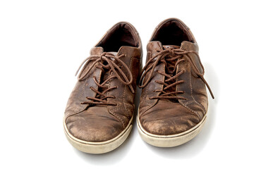 Textured worn vintage brown leather men's boots isolated on white background with copy space