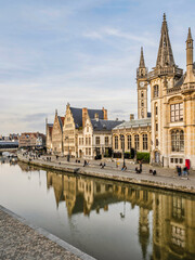 Fototapeta na wymiar Historic medieval buildings and their reflection on Leie river in Ghent, Belgium