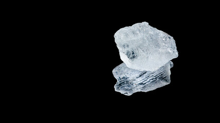 Isolated clear alum cubes on dark background concept for spa and body deodorant industrial