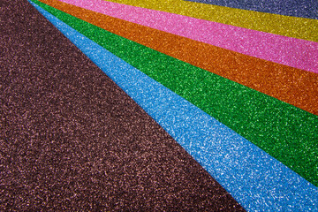 Rainbow glitter texture background.Multicolored rainbow glitter background.