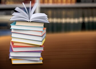 A simple composition of many books, stack or pile of books on wooden table concept