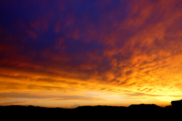 Fototapeta na wymiar Brilliant Sunset or Sunrise over Mountains