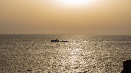 warm sunset light in Menorca - 520910116