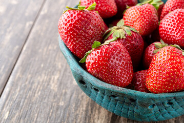 Fresh strawberries close-up in a vintage plate. Space for text.