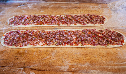 Pide; in English “flatbread” with ground beef and vegetable fillings on top, is a delicious and popular fast food of Turkish Cuisine.