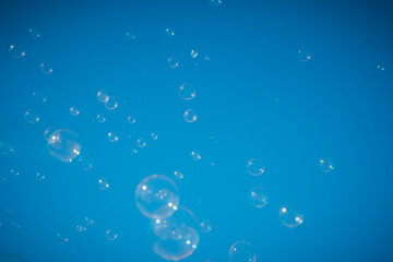 soap bubbles in the air with blue sky