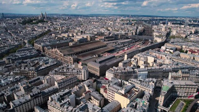 Aerial view of Gare de l'Est railway station in Paris, France, circle pan, day