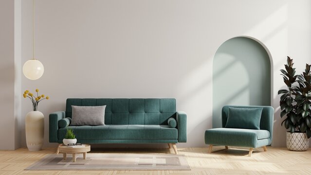 Living room with green armchair and green sofa on empty white wall background.