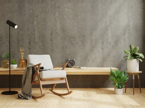 Modern minimalist interior with a gray armchair on empty cement wall background.