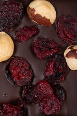 bar of natural dark bitter chocolate with natural whole hazelnuts and cranberries