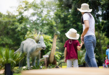 Mother to adventure travel in history park with son, asian child, kid or little boy. Include...