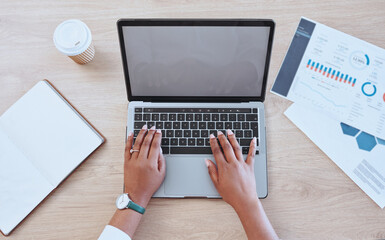 Digital marketing hands typing a report on a blank computer. Female office worker looking at...