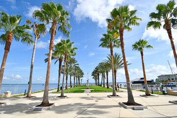Waterfront Park with palm trees along the Sanford riverwalk near downtown Sanford, Florida.  - obrazy, fototapety, plakaty