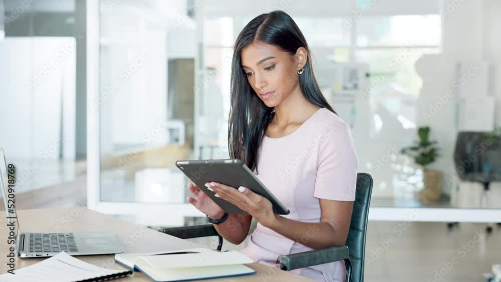 Aufkleber young female intern looking at, typing and checking social media on tablet in modern office. employe