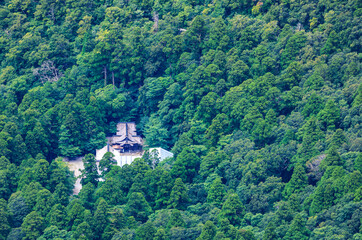 Fototapeta na wymiar Overhead view of Daisen Temple in clearing surrounded by green forest